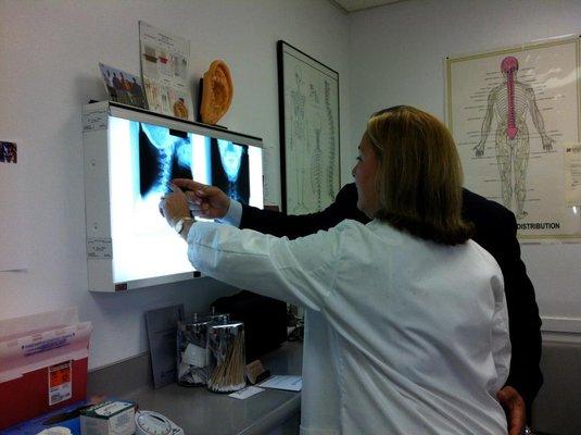 Dr. Nancy Elliott interpreting x-rays at the office