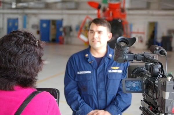 Susan O'Connor Fraser interviewing a member of the U.S. Coast Guard.