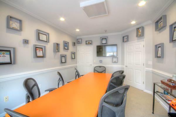 Conference room, decorated with awards from industry associations.