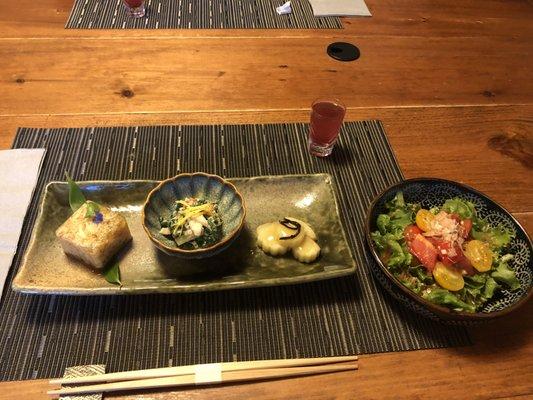 Appetizers, wild grape sake, and salad with home-made ginger sauce