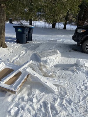 How the men left the styrofoam, wrappings, and packing materials from the new appliances.