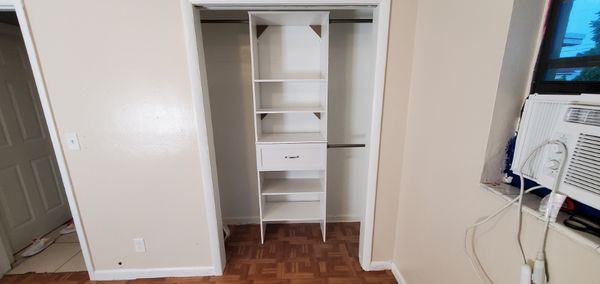 Closet after custom shelving added.