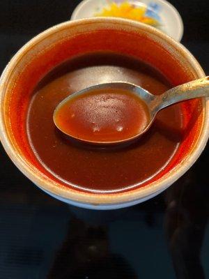 Oily broth chock full of chipotle chili powder. Guaranteed heartburn after two bites. And no chicken.