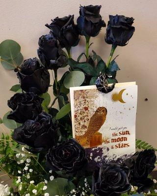 Black roses in the shape of a moon for Halloween.