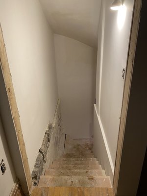 Brand new stairs leading to our basement