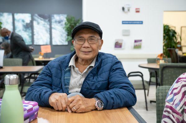 Senior participant smiles as he enjoys the festivities.