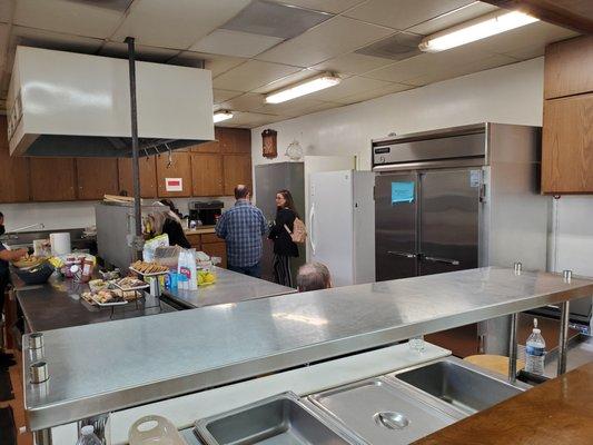 Restaurant size refrigerator, stand alone freezer, and walk in pantry.