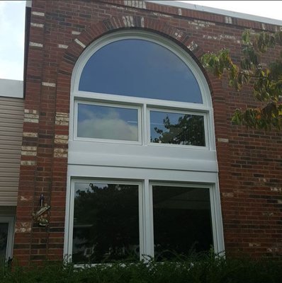 Custom 2 story Andersen arch window replacement. Custom capping for arch.