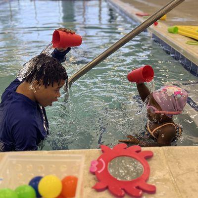 SafeSplash instructors help beginners feel comfortable in the water.