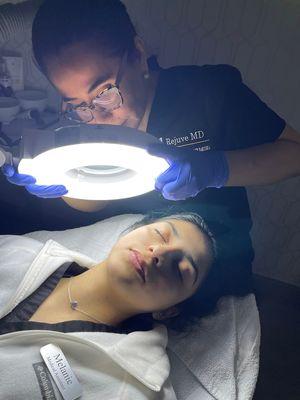 Skin examination at RejuveMD Medspa