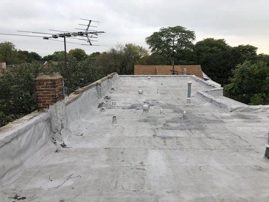 Flat roof on a four unit building.