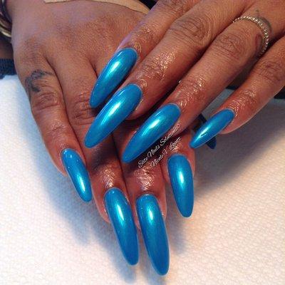 This photo captures a long oval-shaped acrylic full set with tip extensions...