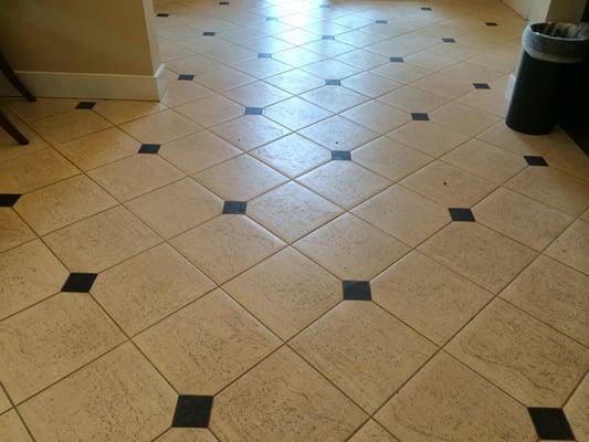 Picture of ceramic tile before we scrubbed and grout cleaned.