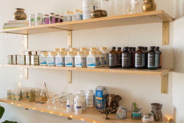 The backdrop of our reception area carries herbal and nutritional supplements.