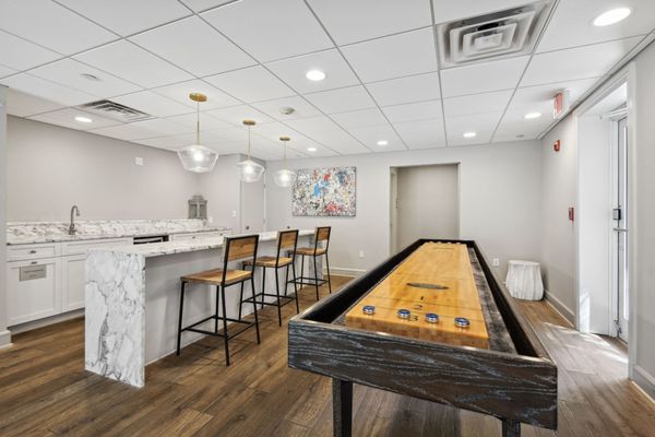 Resident community room with kitchen and shuffleboard