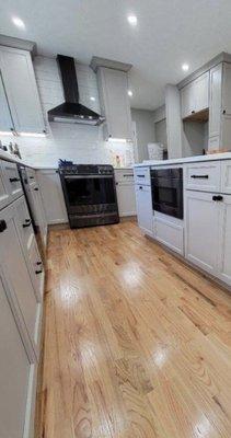 Custom kitchen with added range hood & custom made cabinets.