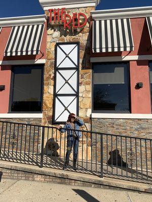 My mom in front of the diner getting ready to go eat