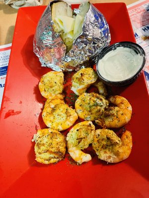 Stuffed shrimps with crab (choice of two sides). I got baked potato and side salad.