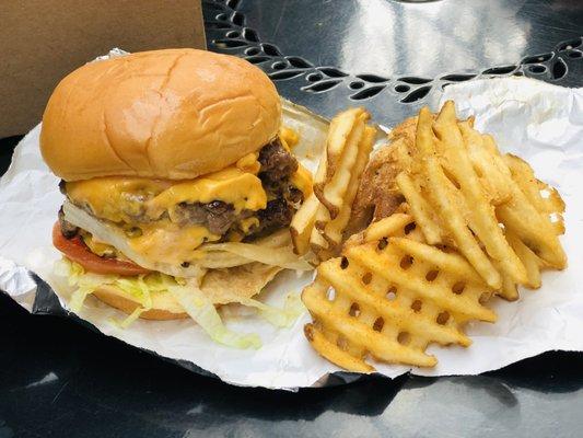 Double Double Dubs Burger and Waffle Fries Burger on potato bun and handmade beef patties.