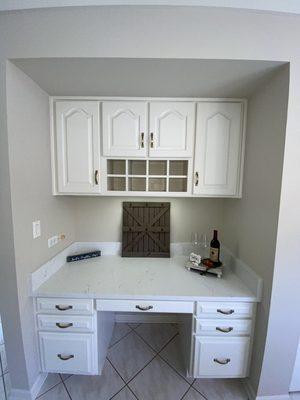 This was previously oak cabinets, we painted it cream added quartz and some fun staging!