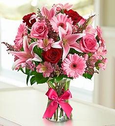 Send this beautiful pink bouquet with a touch of red roses to that special someone.