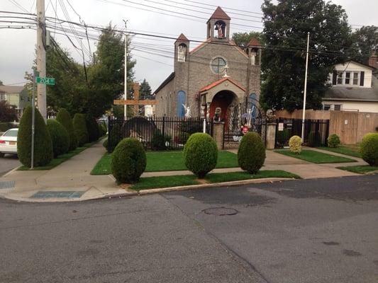 The church we take great care of . Many pines and flowers