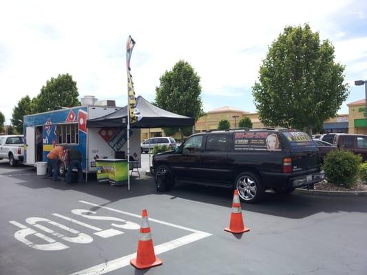 Our booth in Palmdale with Domino's Pizza