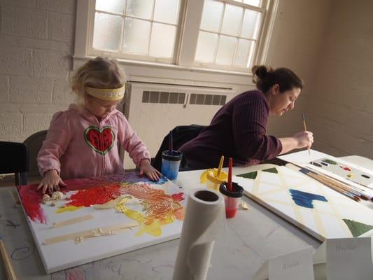 Mother and daughter enjoying the process of art.