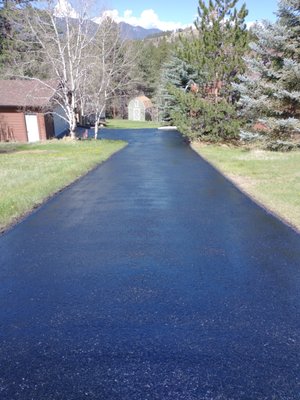 Oil based asphalt seal coating in Bailey Colorado.