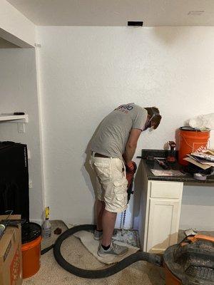 Matt creating the foundation hole. Please disregard the mess, that's all me, I just moved in.