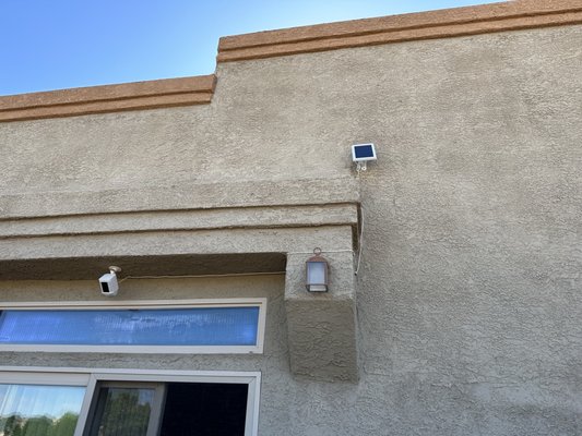 Ring Spotlight Camera w/ solar panel installed in the back yard.