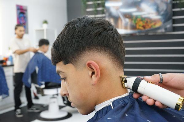 Messy crop haircut with a "drop-fade" on the sides.