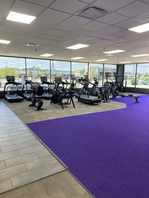 Cardio equipment on the far left side of the gym.