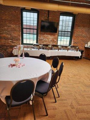 Function room has skylights and a view of the road.