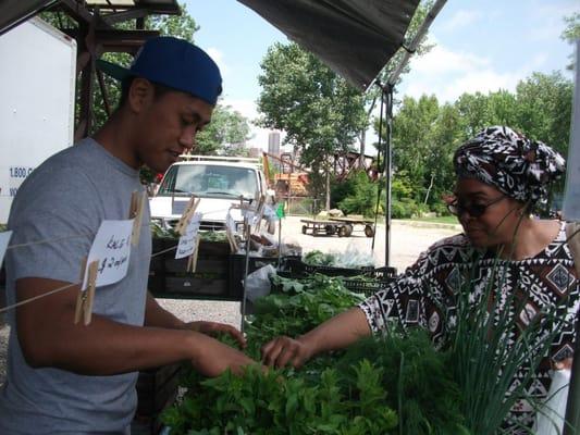 Happy customer shopping at a Glebocki Farms market