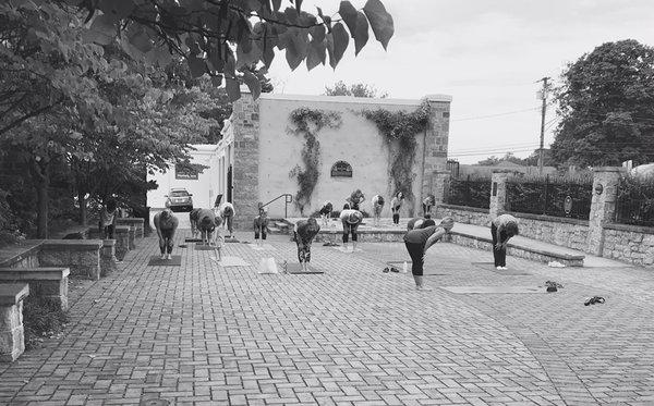 Community yoga in the courtyard.