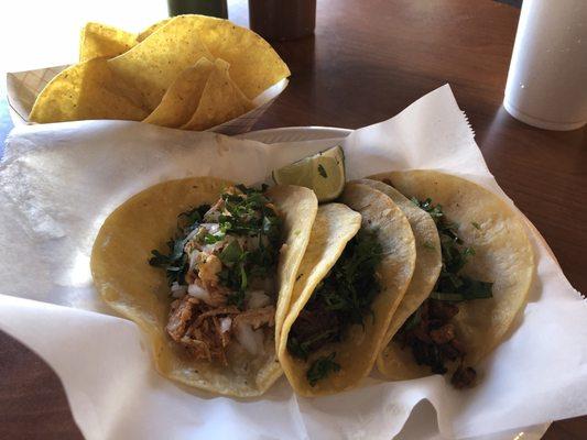 Pollo, Al Pastor, and Barbacoa tacos on flour tortillas. Chips and salsa are included with your meal.