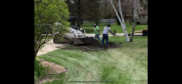 30x45 patio Menomonee Falls/plant install/mulching/seeding