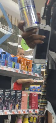 Her peeking through the aisle to my black friend