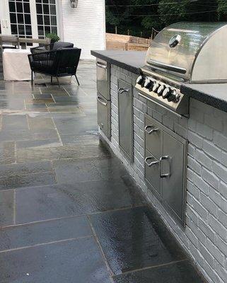 Outdoor kitchen build along with outdoor bluestone patio area.