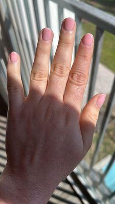 Oval shape, pink shellac nails.