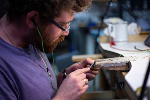 NextFab member working at the jewelry bench