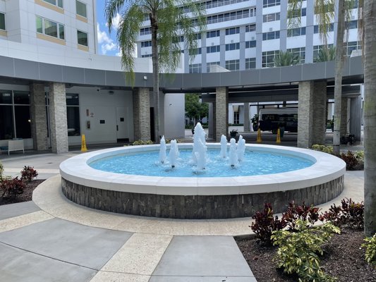 Beautifully lit fountain in front of lobby.