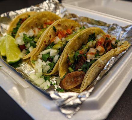 1 Carnitas Taco (Pork), 1 Tripas Taco, 1 Barbacoa (Beef) Taco and 1 Alpastor Taco (marinated pork).