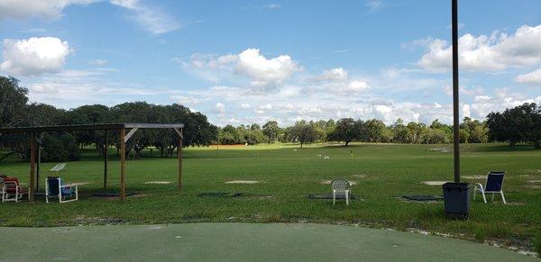 Driving range with putting green in foreground