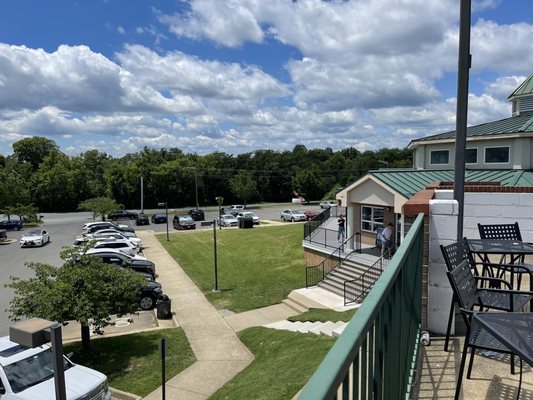 View of the parking area and main building from upper deck of driving range