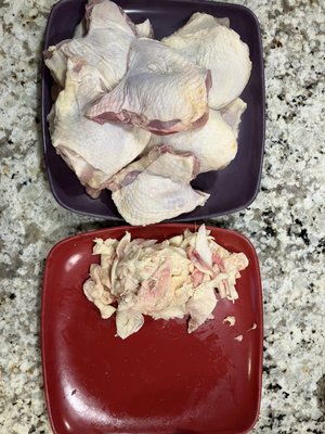 Excess skin and fat removed from chicken thighs.