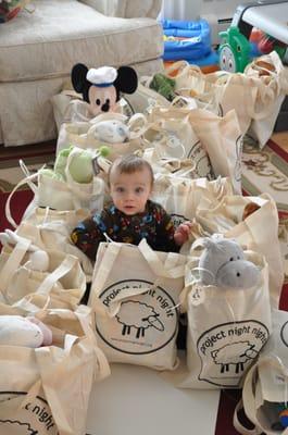 Little volunteer and his assembled Night Night Packages ready to go to the shelter for delivery.