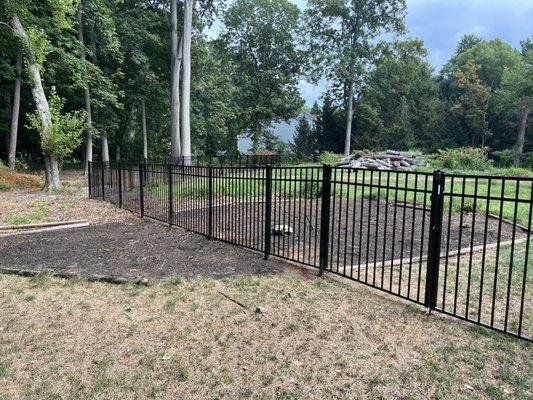 Finished area! Completely weeded and metal fence installed.