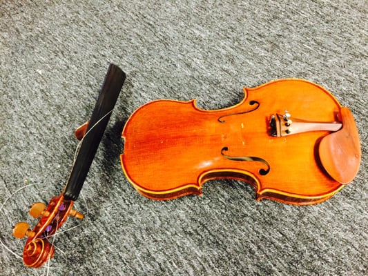 This violin came in to our shop after it was accidently stepped on by musician at a concert in Garland.